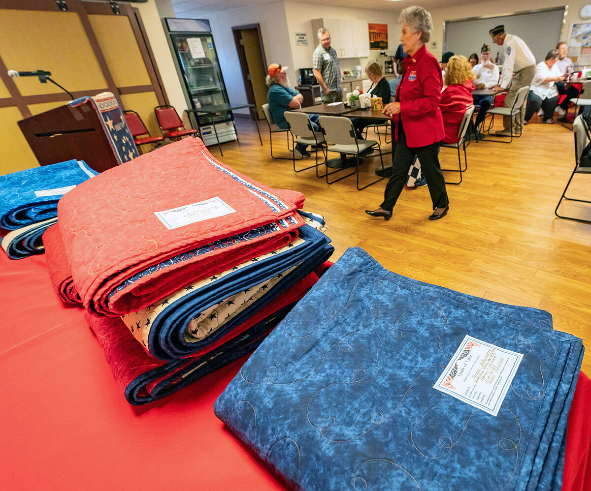 John Clausen/Pahrump Valley Times A stack of brand new, handmade quilts await their time to be ...