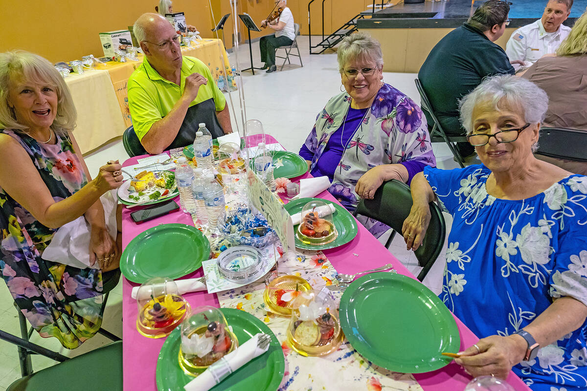 John Clausen/Pahrump Valley Times NyECC President Willi Baer, right, sits with other luncheon a ...
