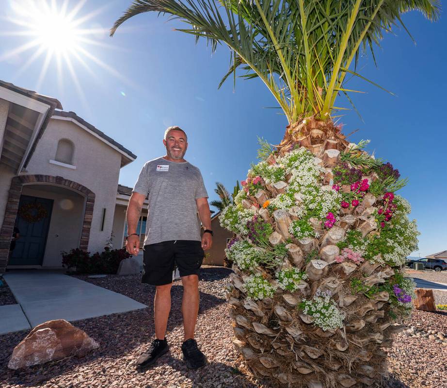 John Clausen/Pahrump Valley Times 3815 N. Mayfield Ranch Rd property owner Gary Rurans stands b ...