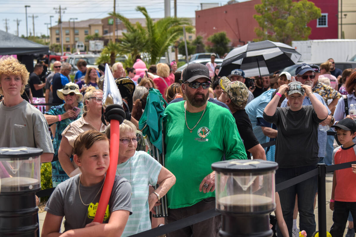 Residents of Pahrump wait in line to attend the grand opening of the Pinkbox Doughnuts shop loc ...