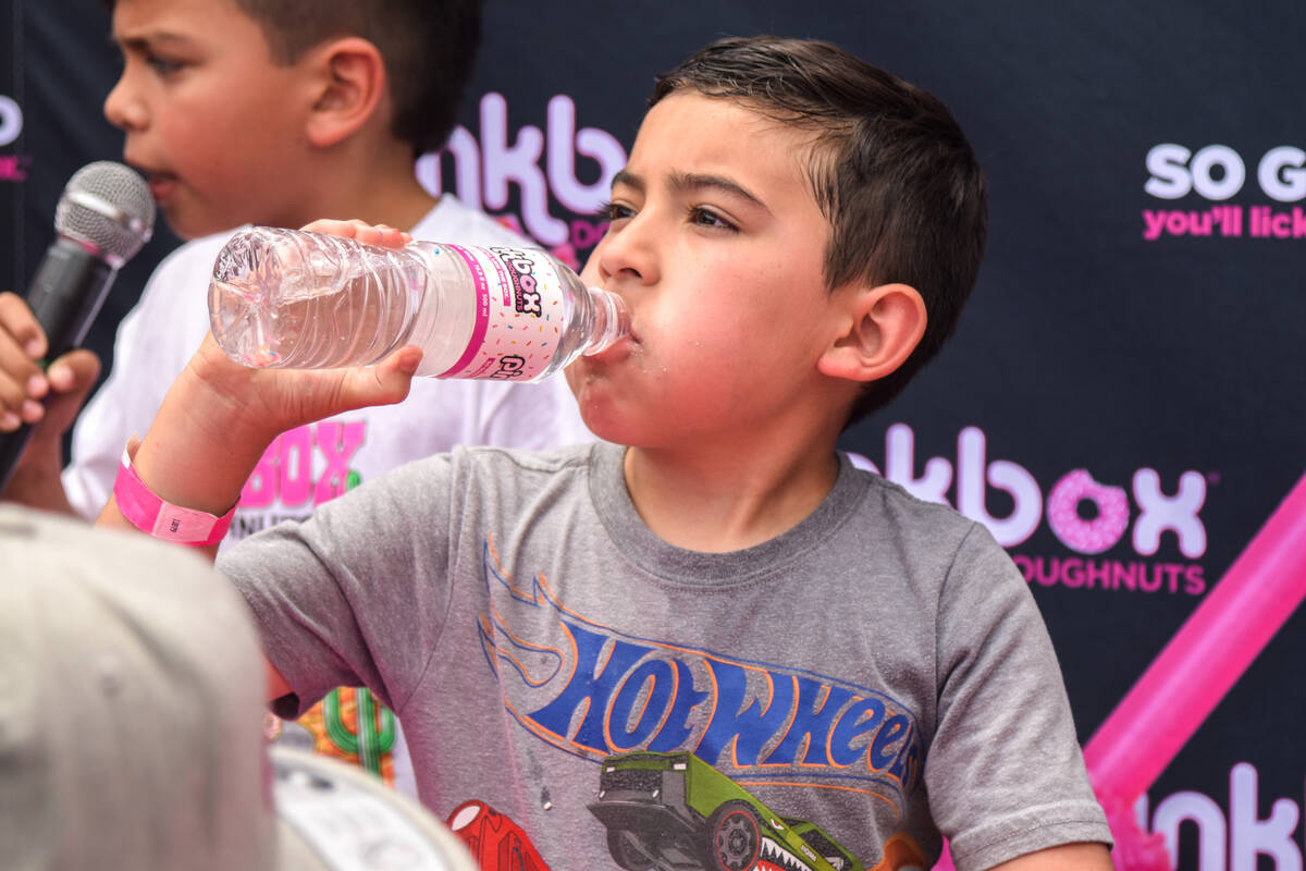 Zuko Garcia eats donuts for the kids doughnut eating contest before winning a year supply of do ...