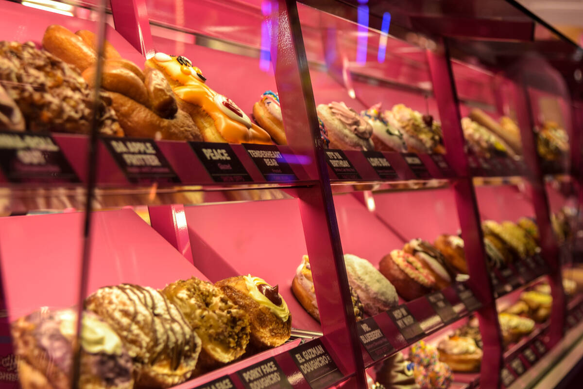 An array of craft doughnuts at the grand opening of the Pinkbox Doughnuts shop located inside t ...