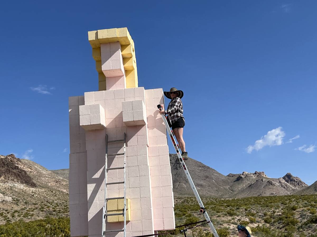 Brian Gibson/Special to the Pahrump Valley Times Michelle Graves climbs a ladder for the painti ...