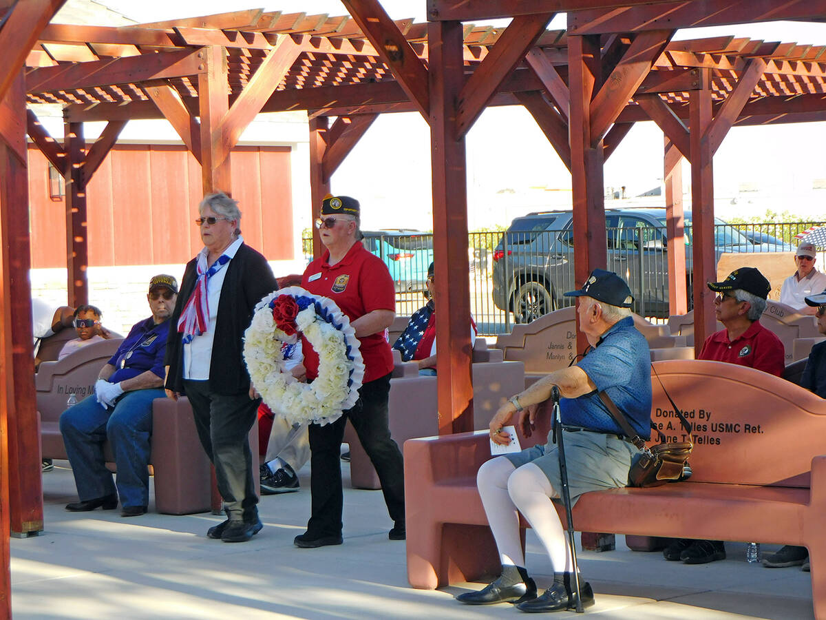 Robin Hebrock/Pahrump Valley Times Linda Wright and Cathy Girard conduct the wreath ceremony at ...