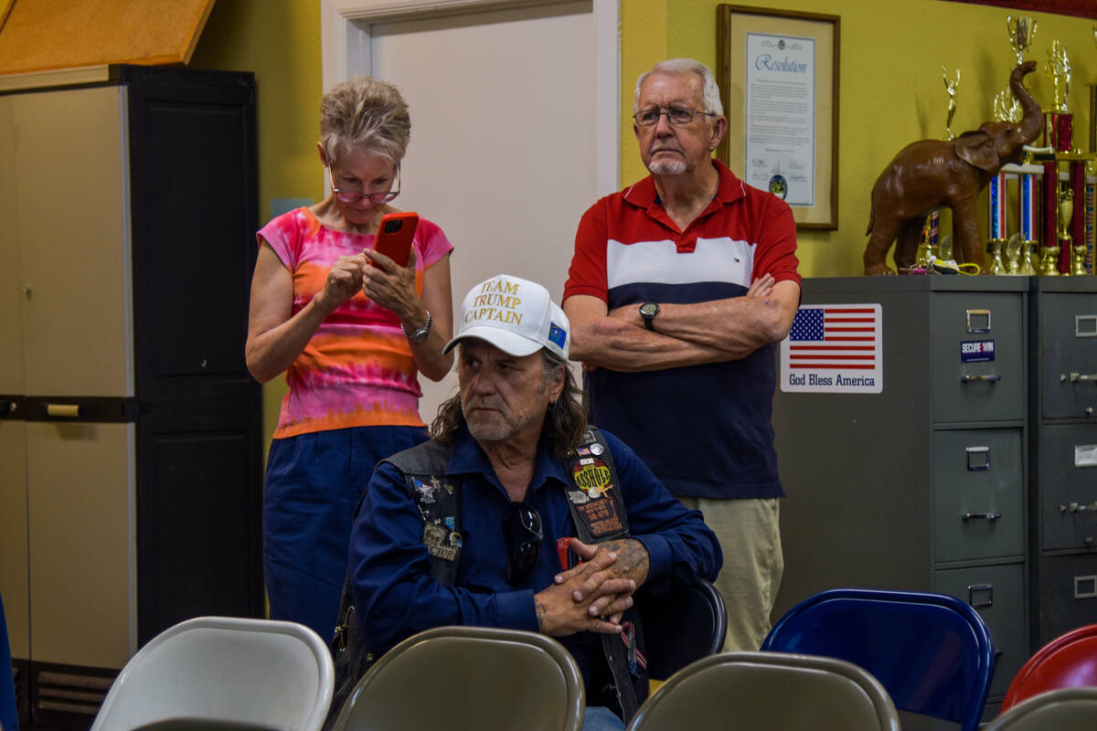 Tamie Pitman (left) and other attendees to the Nye County Republican Central Committee watch pa ...