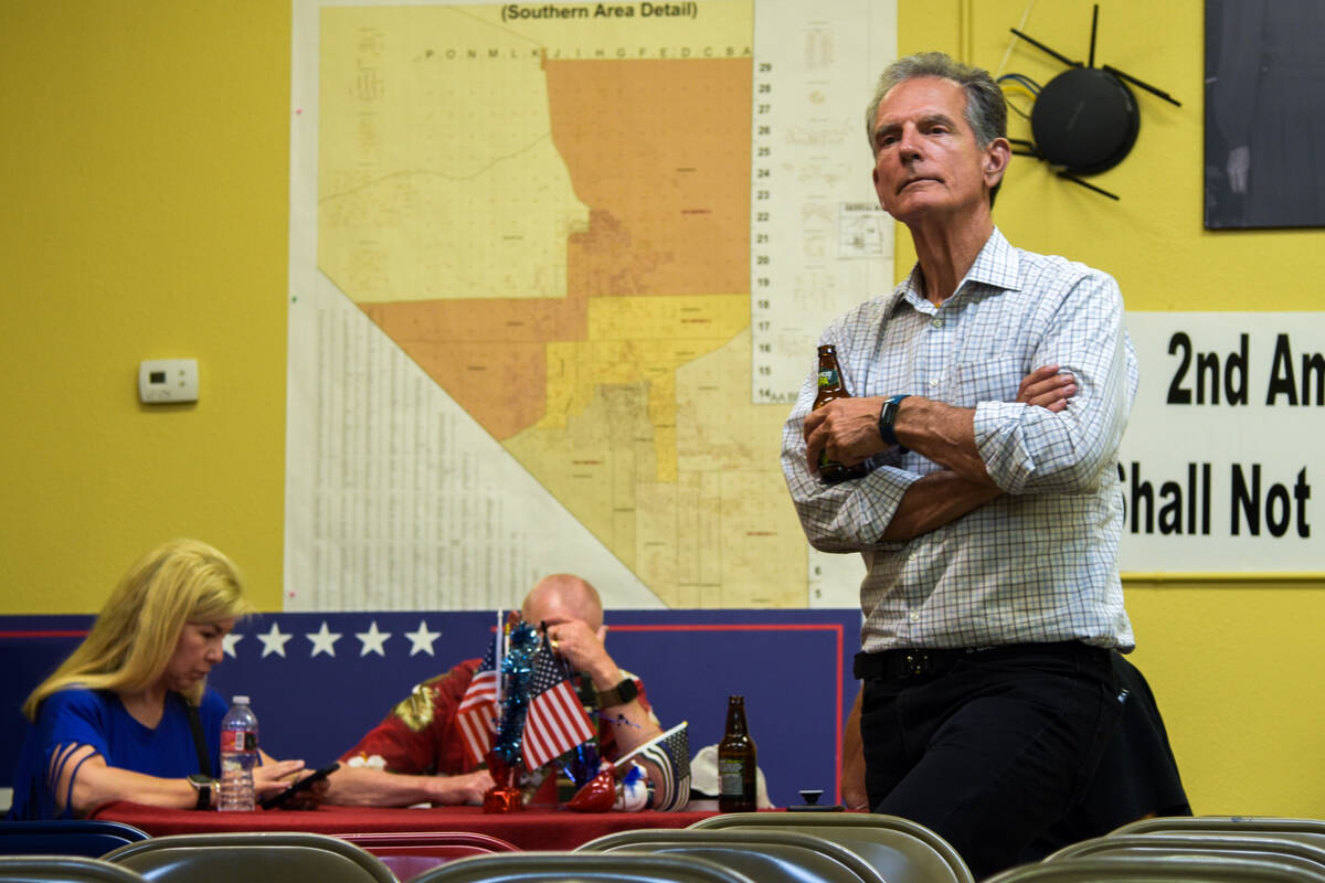 Attendees to the Nye County Republican Central Committee watch party gather to view the result ...