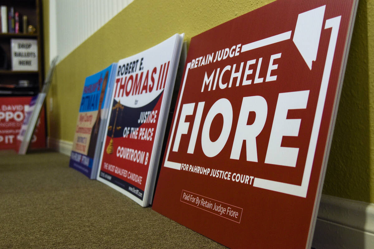 Campaign signs inside the Nye County Republican Central Committee Headquarters for a watch part ...