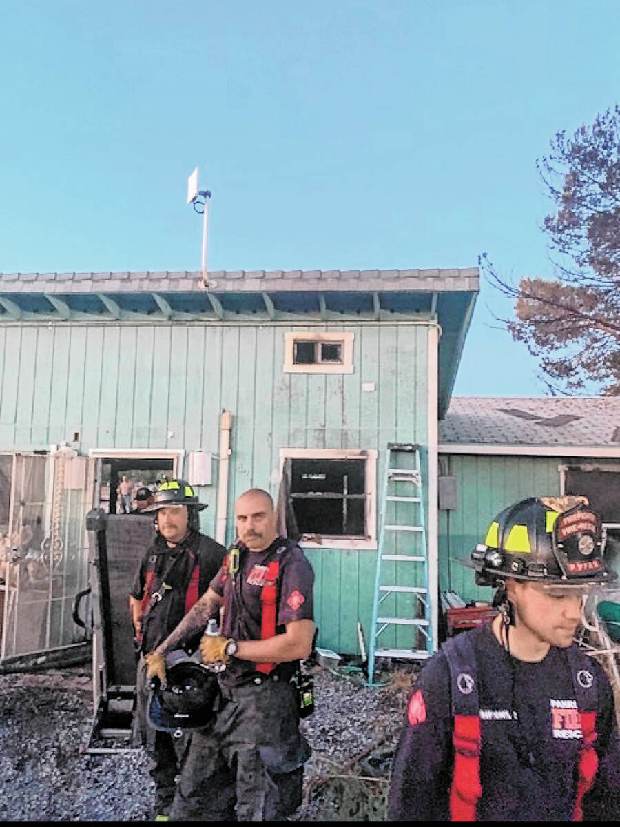 Special to the Pahrump Valley Times Crews battled a fire on Comanche Drive on the s ...