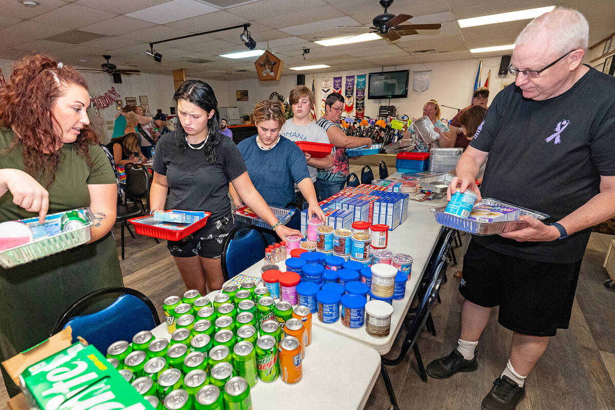 John Clausen/Pahrump Valley Times Patry-goers are pictured building Birthday Boxes at Shannon A ...