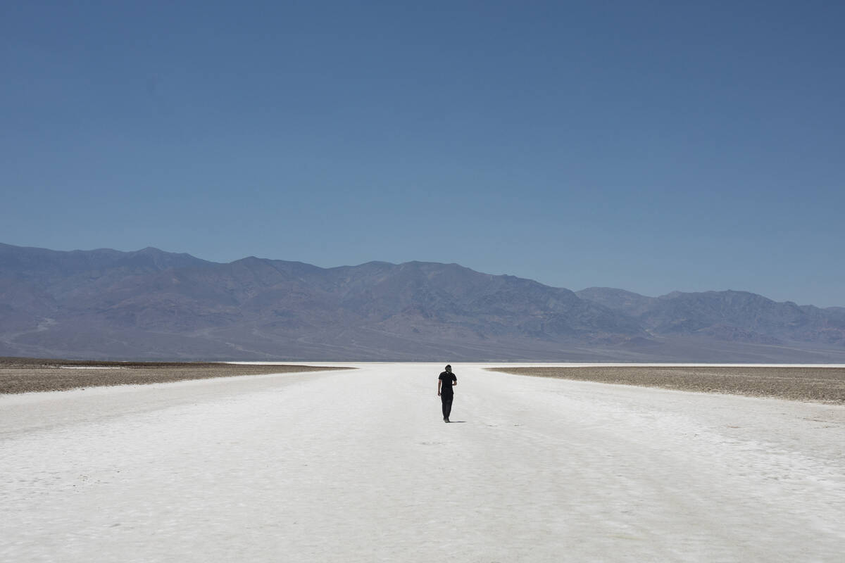 Sheik Mabrouki, of Algeria, walks at Badwater Basin on Monday, July 8, 2024, in Death Valley Na ...