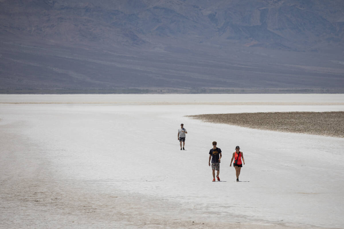 Tourists visit Badwater Basin on Monday, July 8, 2024, in Death Valley National Park, Calif. (D ...