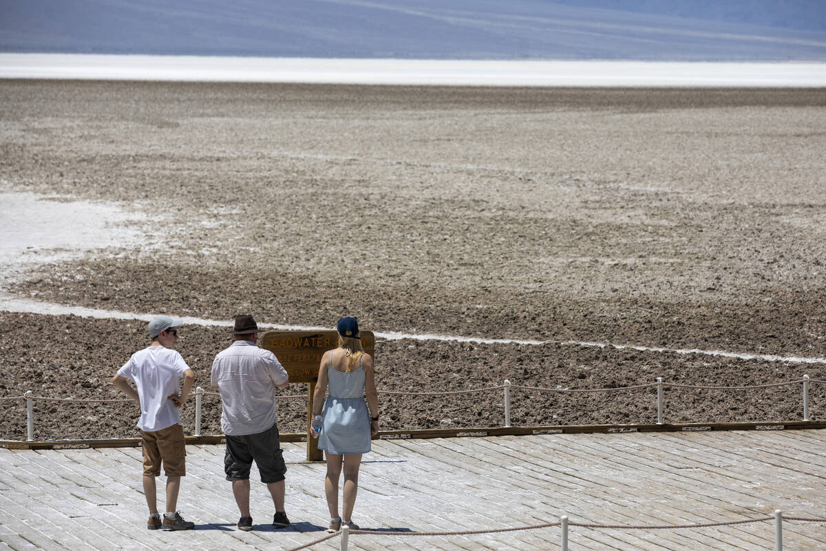 Tourists visit Badwater Basin on Monday, July 8, 2024, in Death Valley National Park, Calif. (D ...