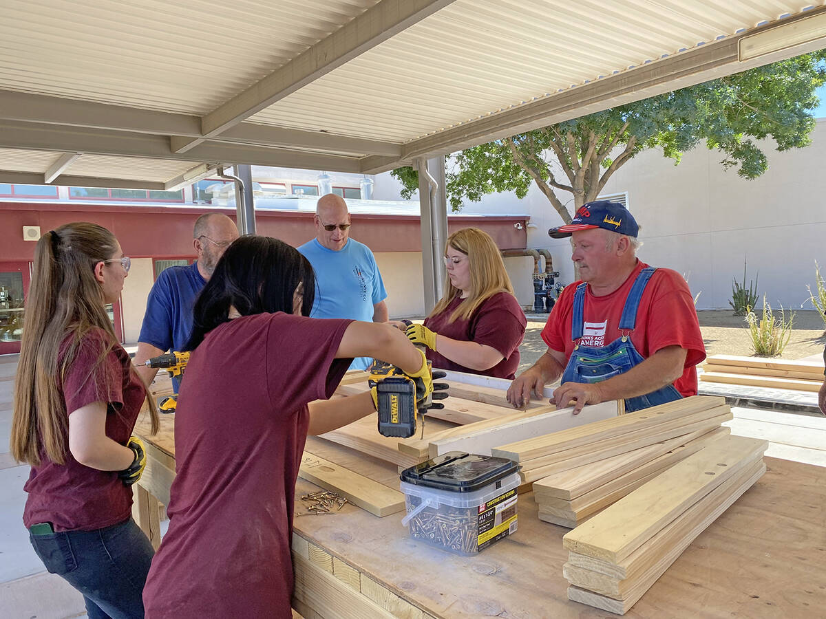 Robin Hebrock/Pahrump Valley Times Taken July 2, this photo shows several teenagers working on ...