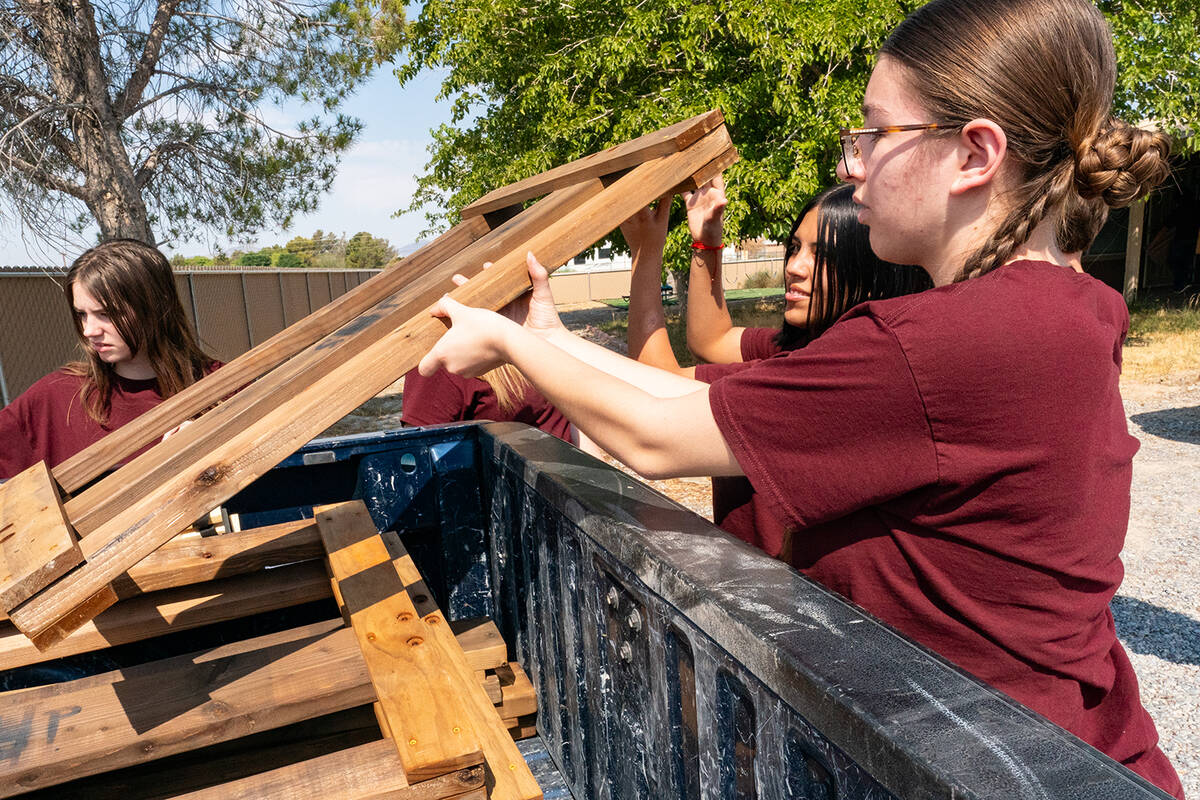 John Clausen/Pahrump Valley Times Teens are pictured unloading bed frames at the Sleep in Heave ...