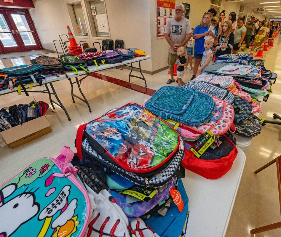 John Clausen/Pahrump Valley Times A line of brand new backpacks awaited those who attended the ...