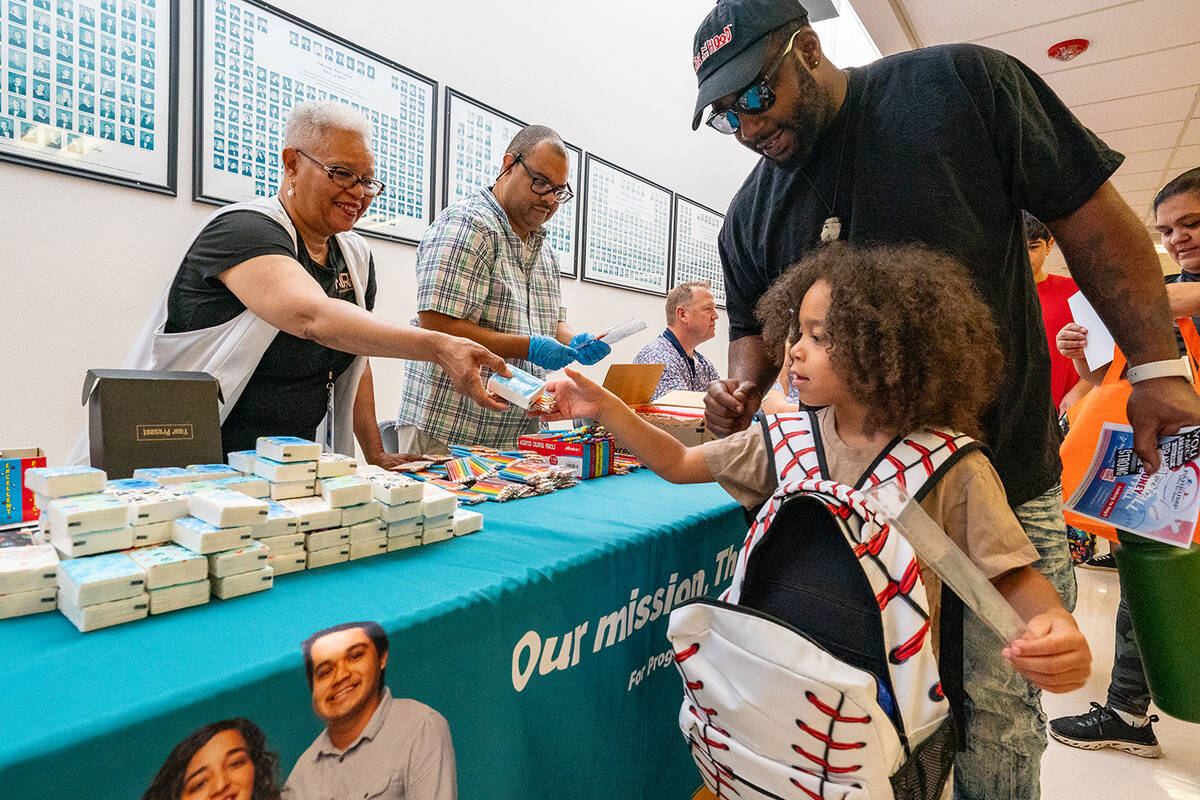 John Clausen/Pahrump Valley Times A youngster is pictured receiving supplies from one of the ma ...