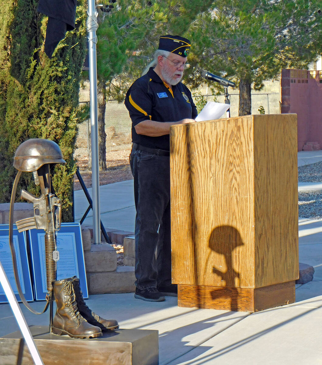 Robin Hebrock/Pahrump Valley Times U.S. Army Capt. Jim Eisenberg reads "Just a Common Soldier" ...