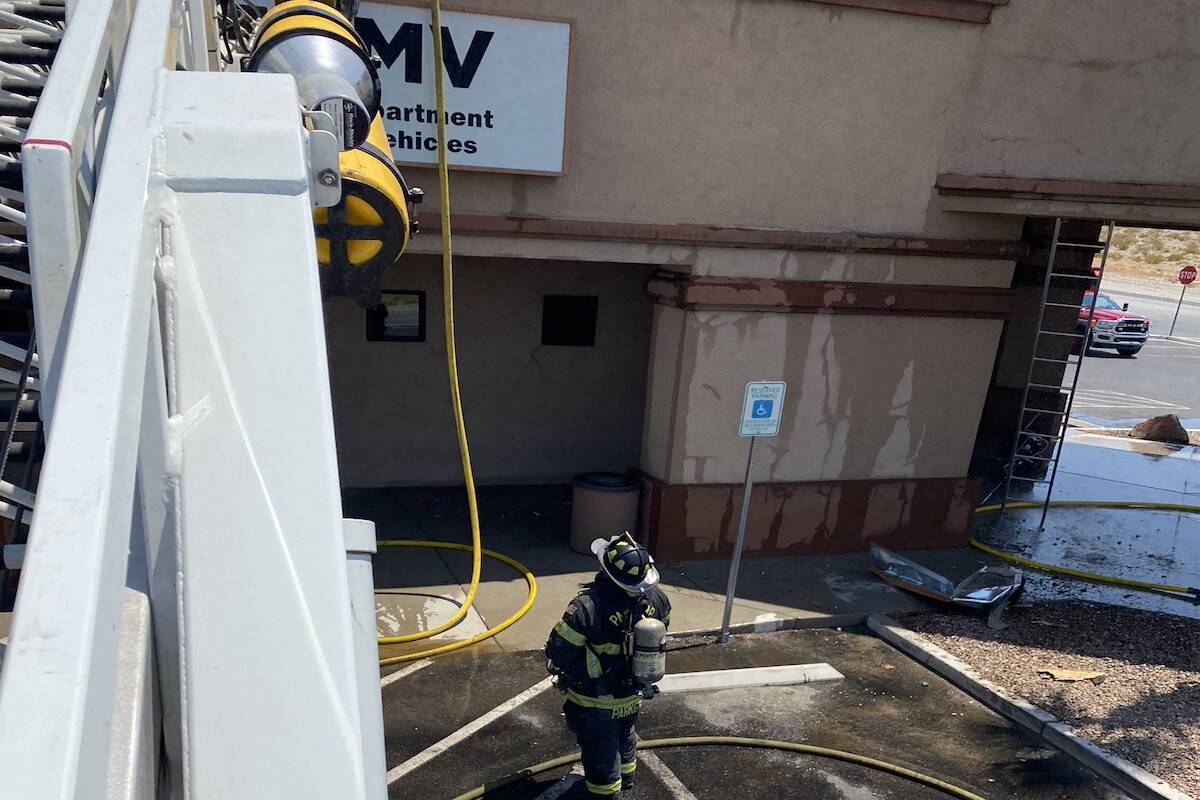 Members of the Pahrump Valley Fire and Rescue extinguished a fire at the Pahrump DMV office on ...