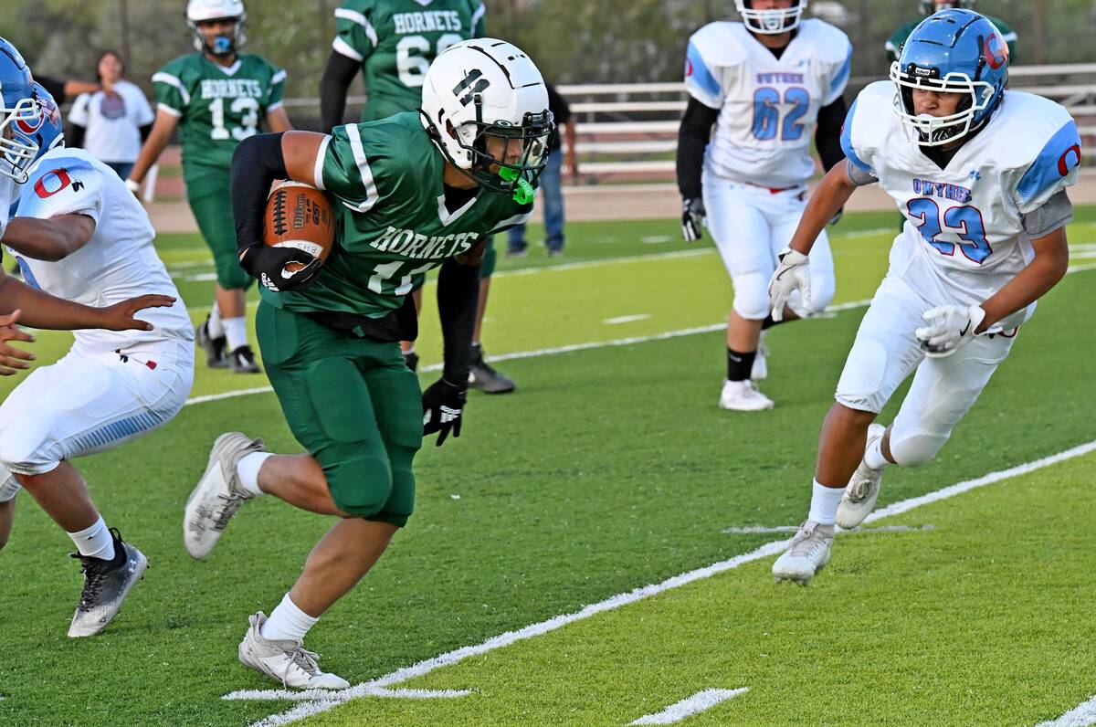 Beatty's Reese Taylor attempts to run the ball against Owyhee players in a non-conference game ...