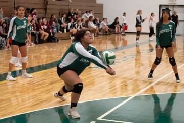 Beatty volleyball Jacky Cordova bumps a ball from the Liberty Baptist Academy players on Friday ...