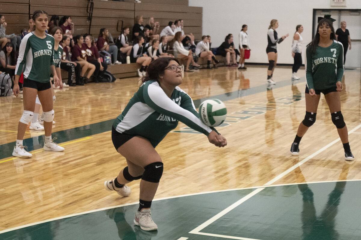 Beatty volleyball Jacky Cordova bumps a ball from the Liberty Baptist Academy players on Friday ...