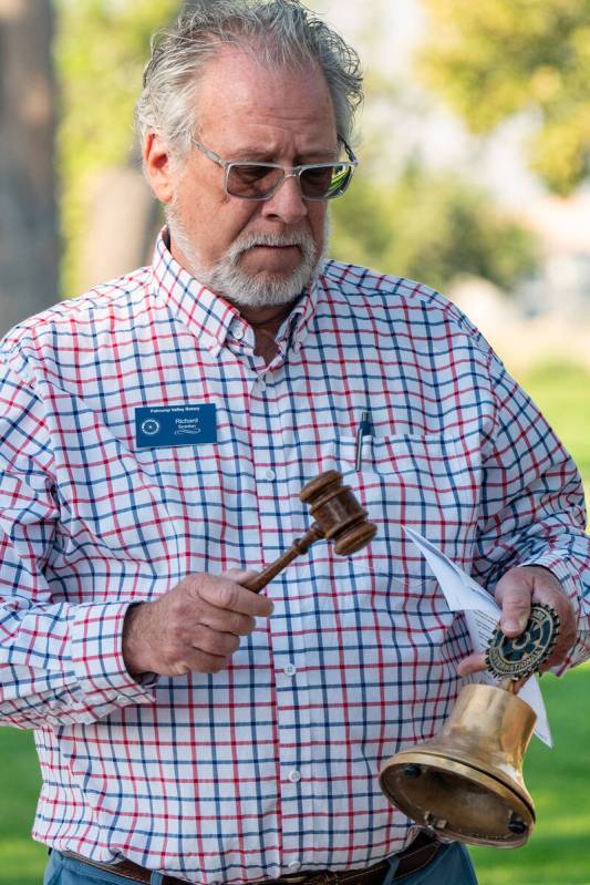 John Clausen/Pahrump Valley Times With a solemn tolling of a bell, Rotarian Rick Scanlan honore ...