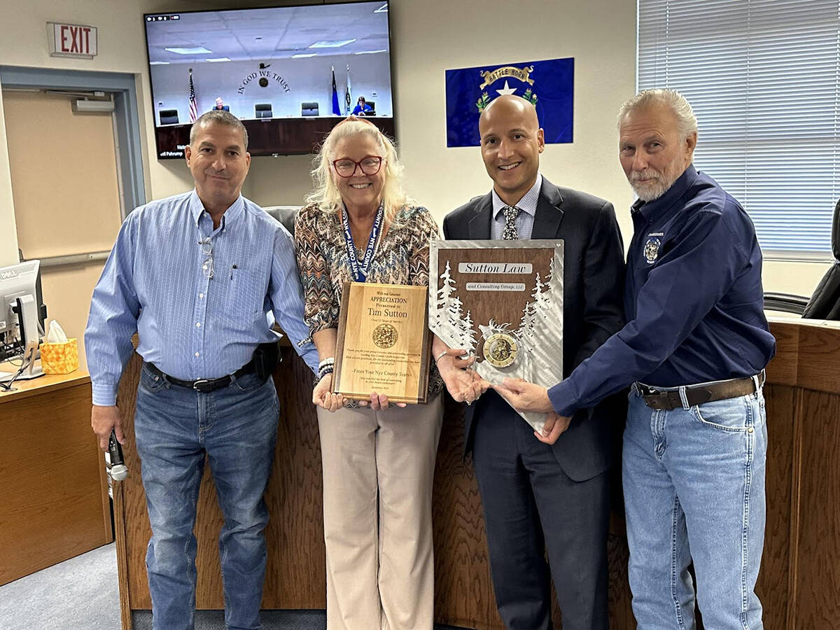 Special to the Pahrump Valley Times Nye County Manager Tim Sutton, second from right, is offici ...