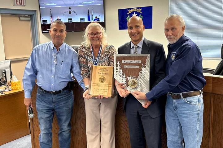 Special to the Pahrump Valley Times Nye County Manager Tim Sutton, second from right, is offici ...