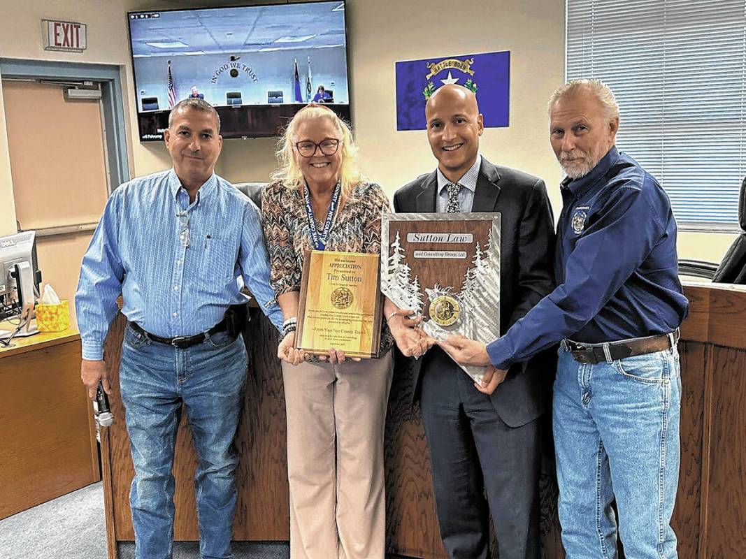 Special to the Pahrump Valley Times Nye County Manager Tim Sutton, second from right, is offici ...