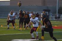 Trojan’s Josh Slusher (32) watches the ball bounce as the Somerset Academy Losee recieve ...