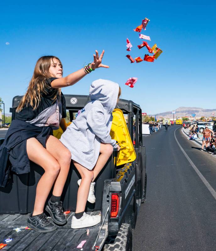 John Clausen/Pahrump Valley Times Goodies fly through the air as a parade participant tosses th ...