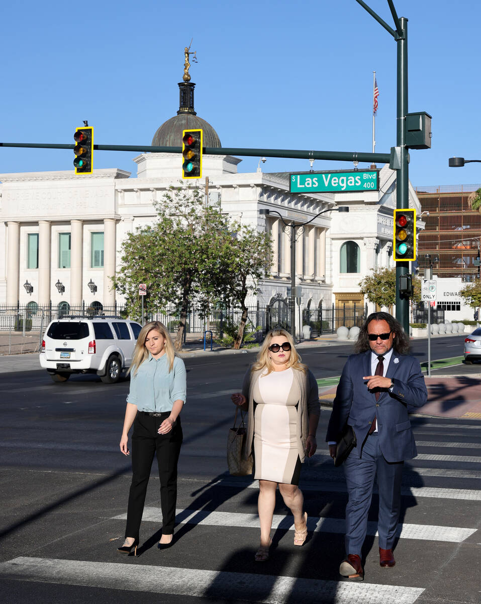 Former Las Vegas Councilwoman Michele Fiore, center, walks to the Lloyd George U.S. Courthouse ...