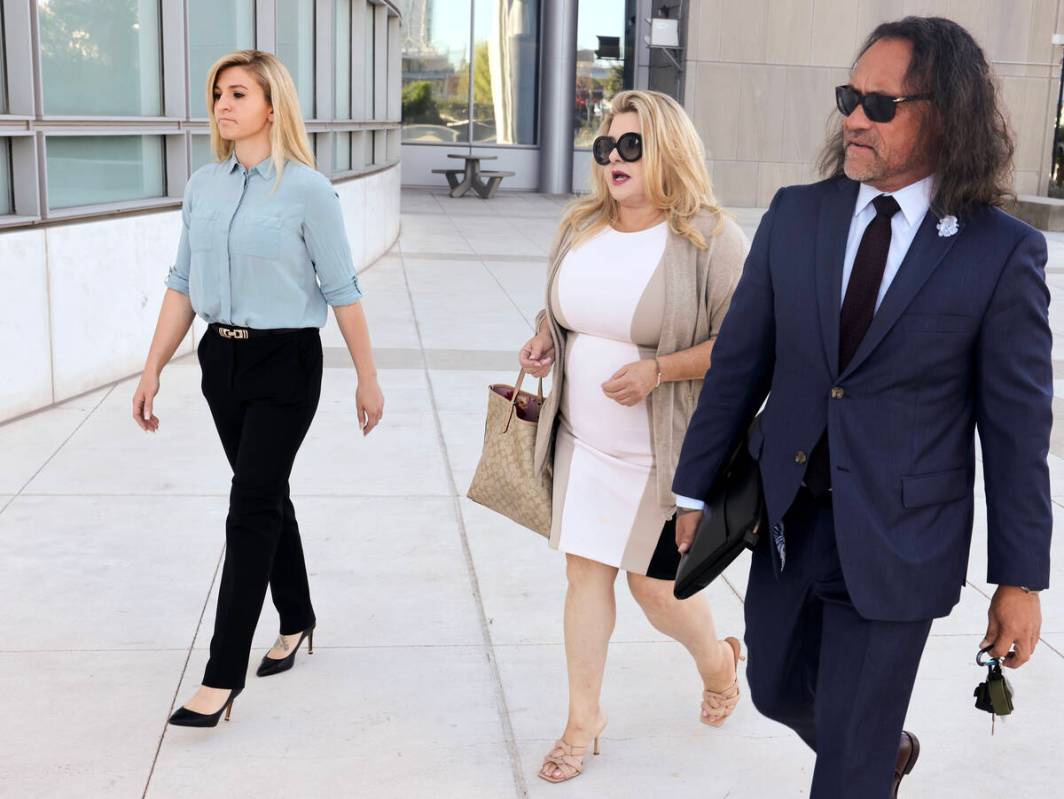 Former Las Vegas City Councilwoman Michele Fiore, center, arrives at the Lloyd George U.S. Cour ...