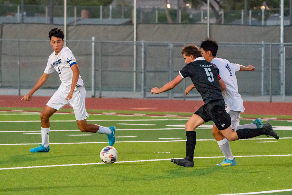 Pahrump Valley's Kohlzin Park (5) (center) runs with the ball against The Meadows School player ...