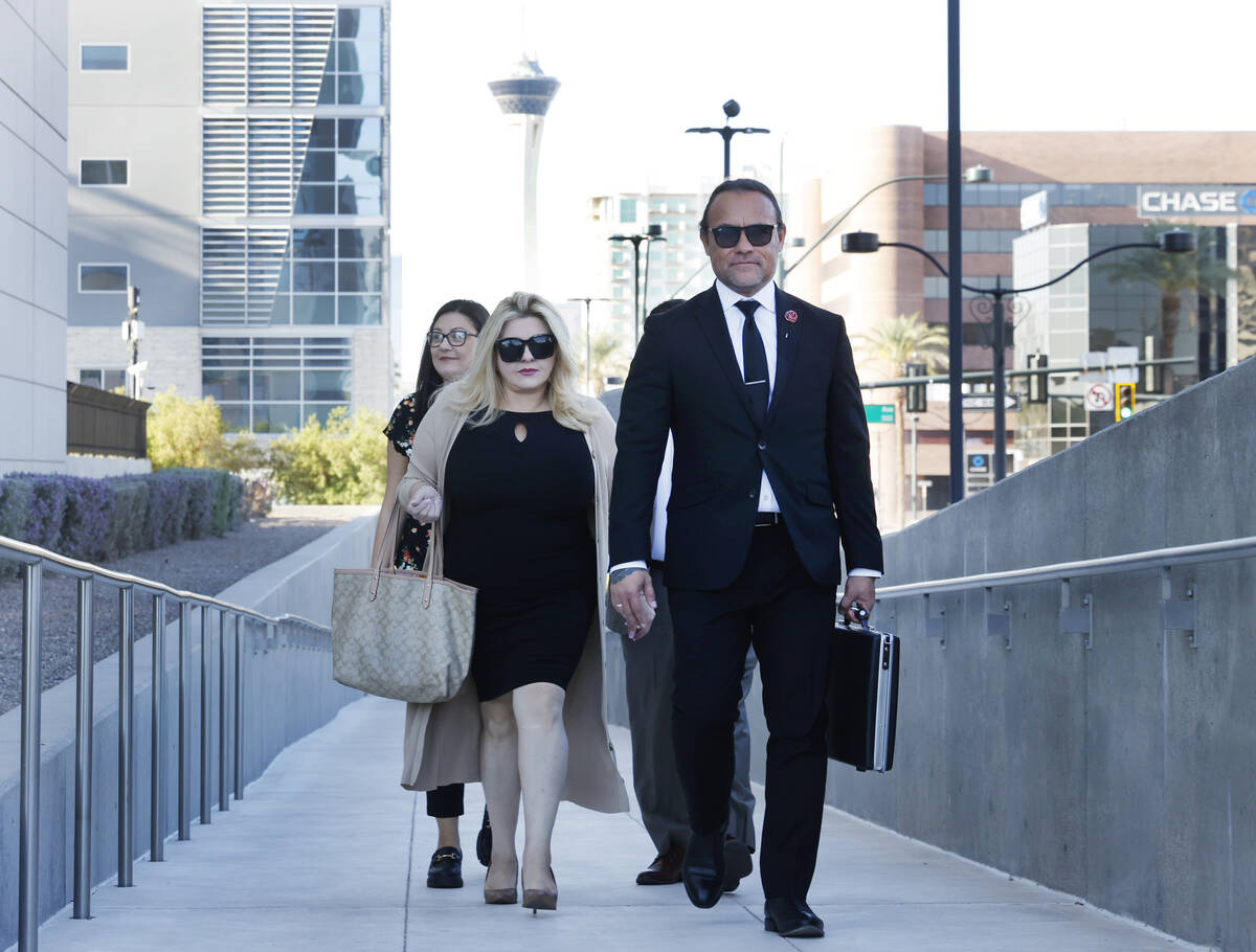 Former Las Vegas City Councilwoman Michele Fiore, left, arrives for her wire fraud trial at the ...