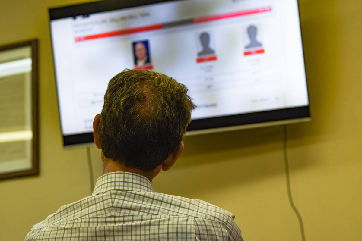 A man watches the results come in for the Nevada primary at the Nye County Republican Central C ...