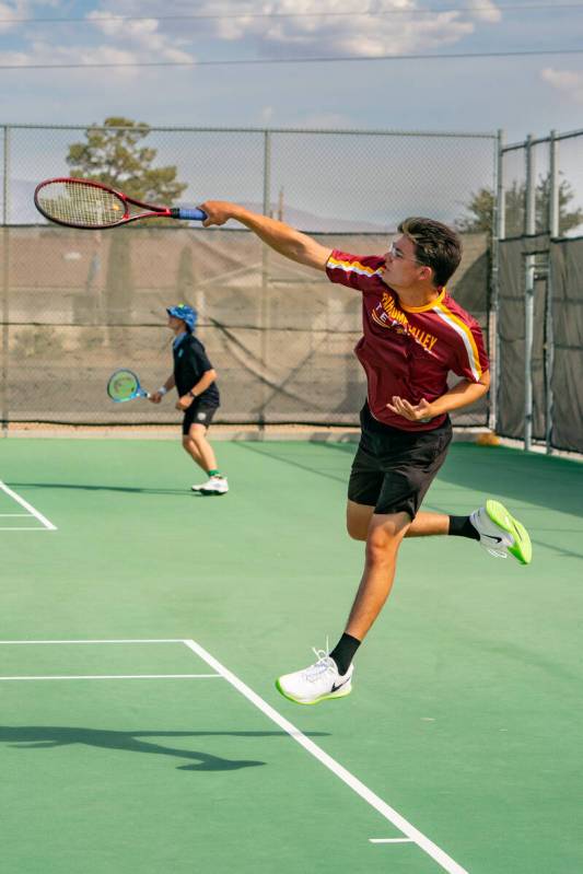 Trojans Milan Vasquez spiked the ball in the air during the first round of the 3A Southern regi ...