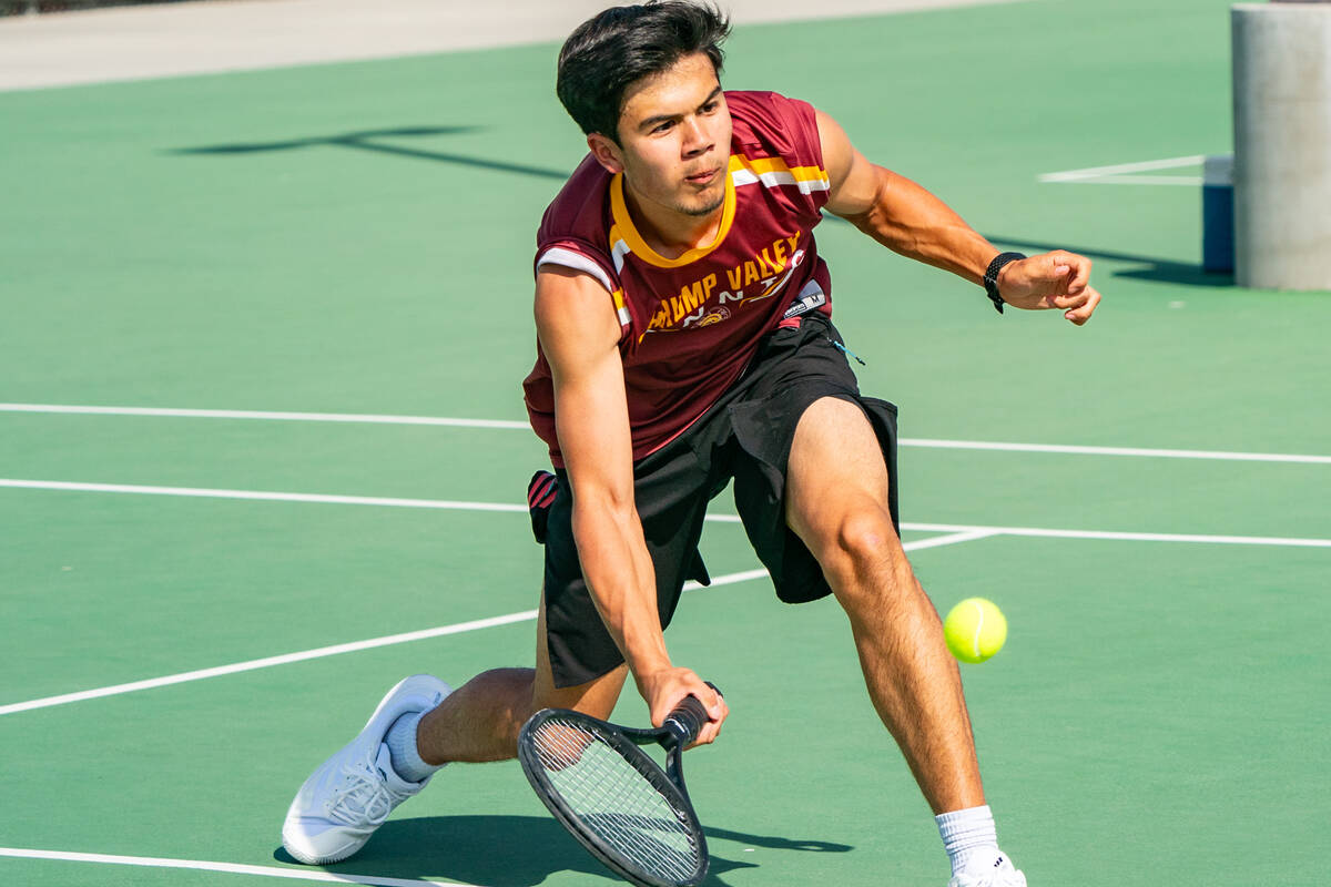 James Dela Rosa squats to receive a ball from Sloan Canyon in the 3A Southern regional playoffs ...