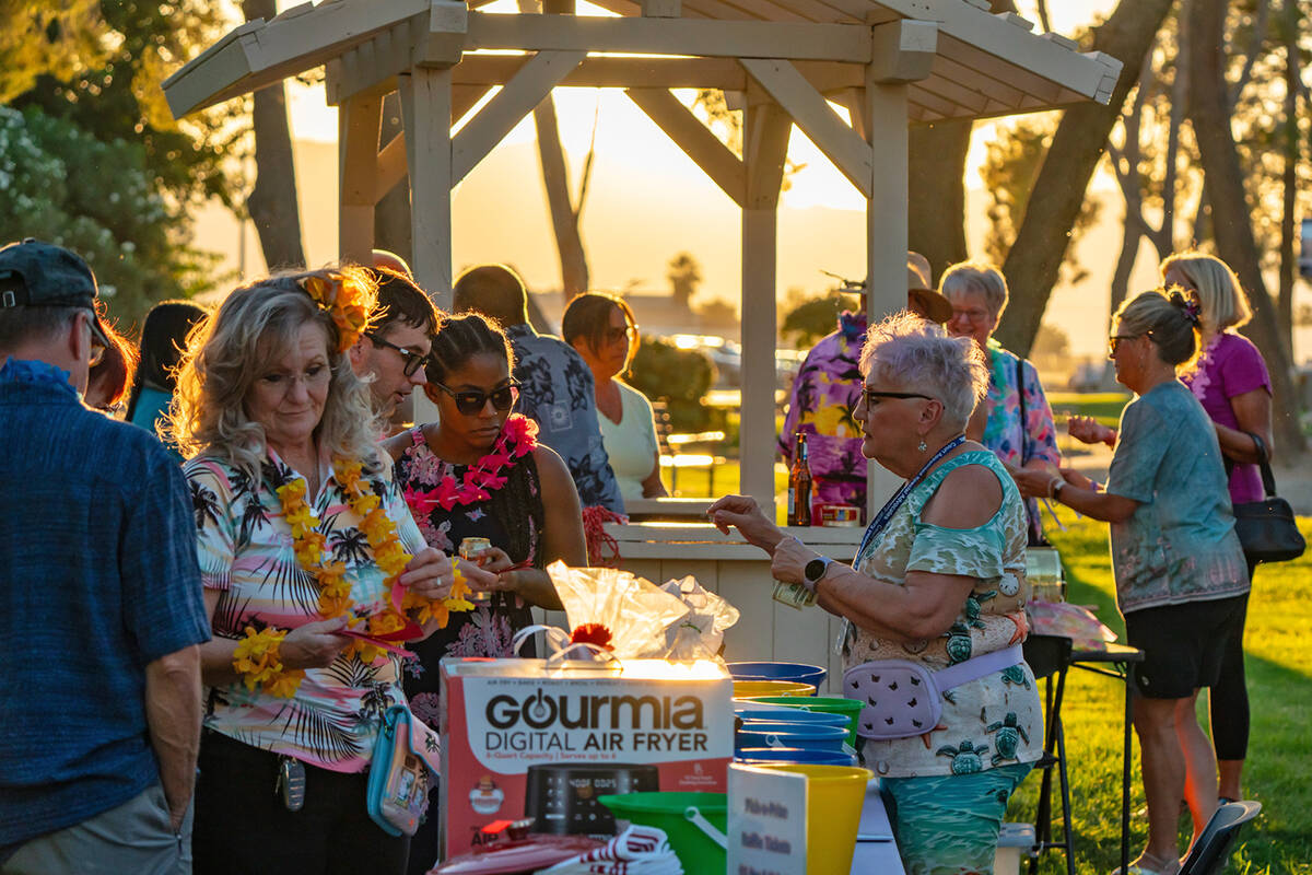 John Clausen/Pahrump Valley Times As the sun set at the Calvada Eye, 2024 Luau attendees surrou ...