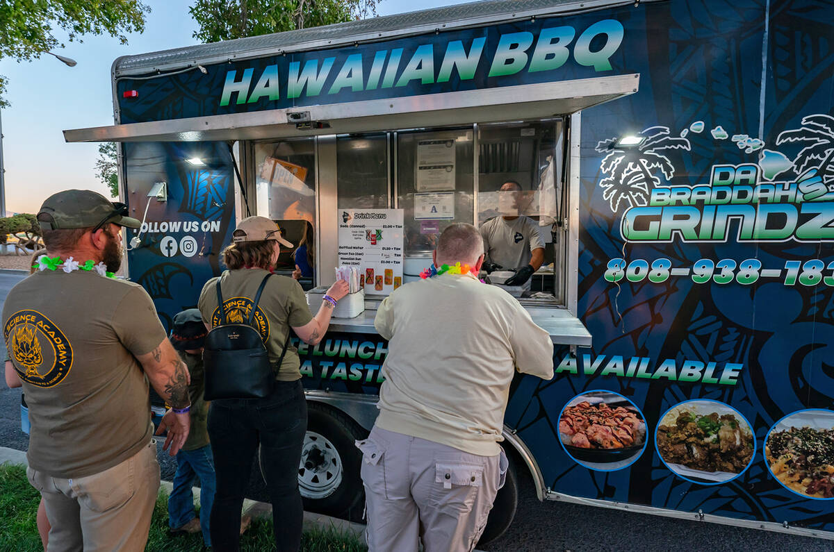 John Clausen/Pahrump Valley Times Bringing the traditional taste to the ACORN Luau, Da Bruddah' ...