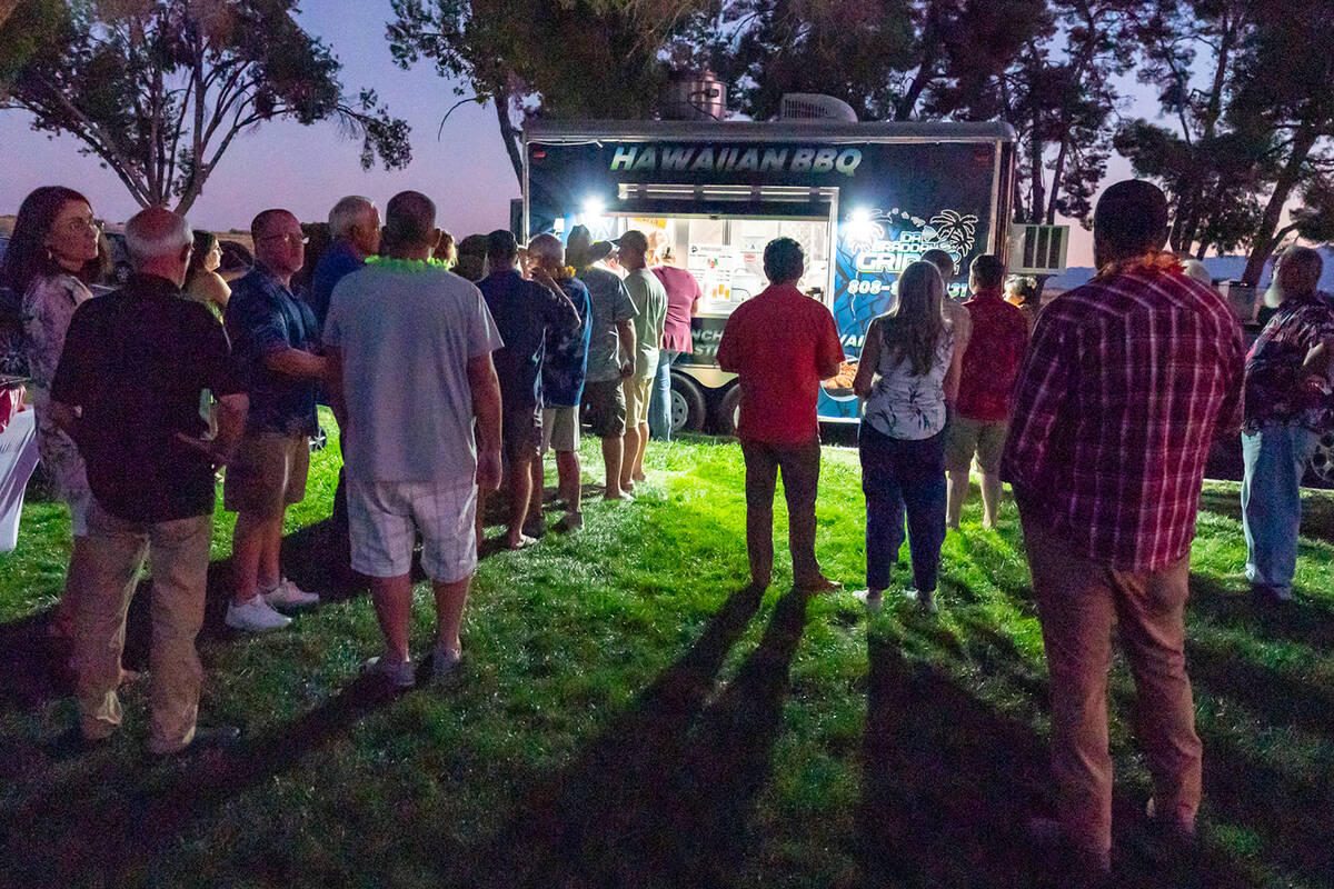 John Clausen/Pahrump Valley Times Hungry Luau patrons line up for some tasty eats from Da Brudd ...