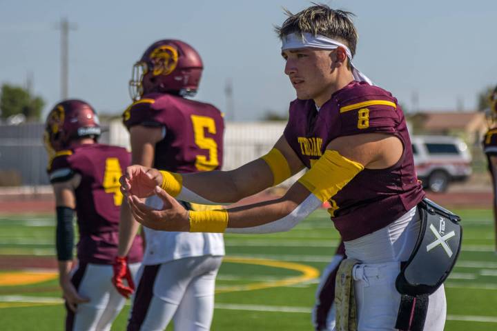 Trojans Kayne Horibe (8) practices passes and throws right before the end of halftime as they a ...