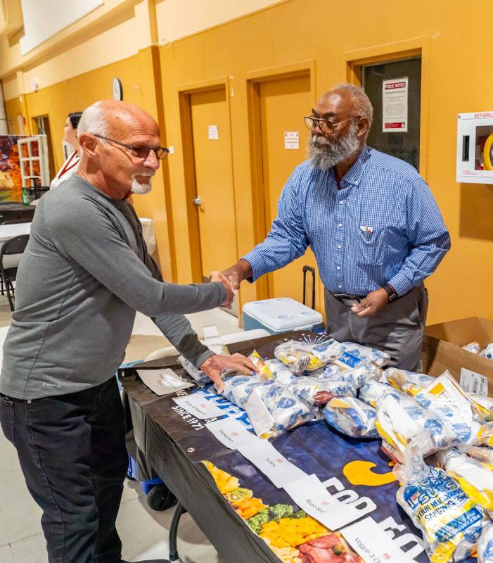 John Clausen/Pahrump Valley Times Ski Censke, left, offered his auctioneer expertise at the Hal ...