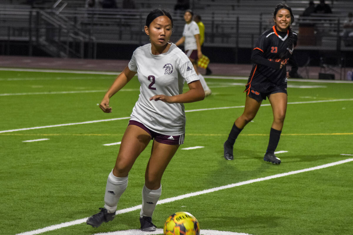 Trojan’s Carlyn Cabajar Williams (2) takes possession of the ball against Chaparral on T ...