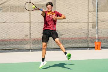 Trojan Milan Vasquez hits the ball toward Sloan Canyon in the first round of the 3A Southern Le ...