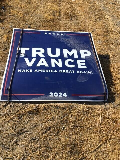 A flattened Trump sign near Homestead Road and Deerskin Street with tire marks and footprints l ...