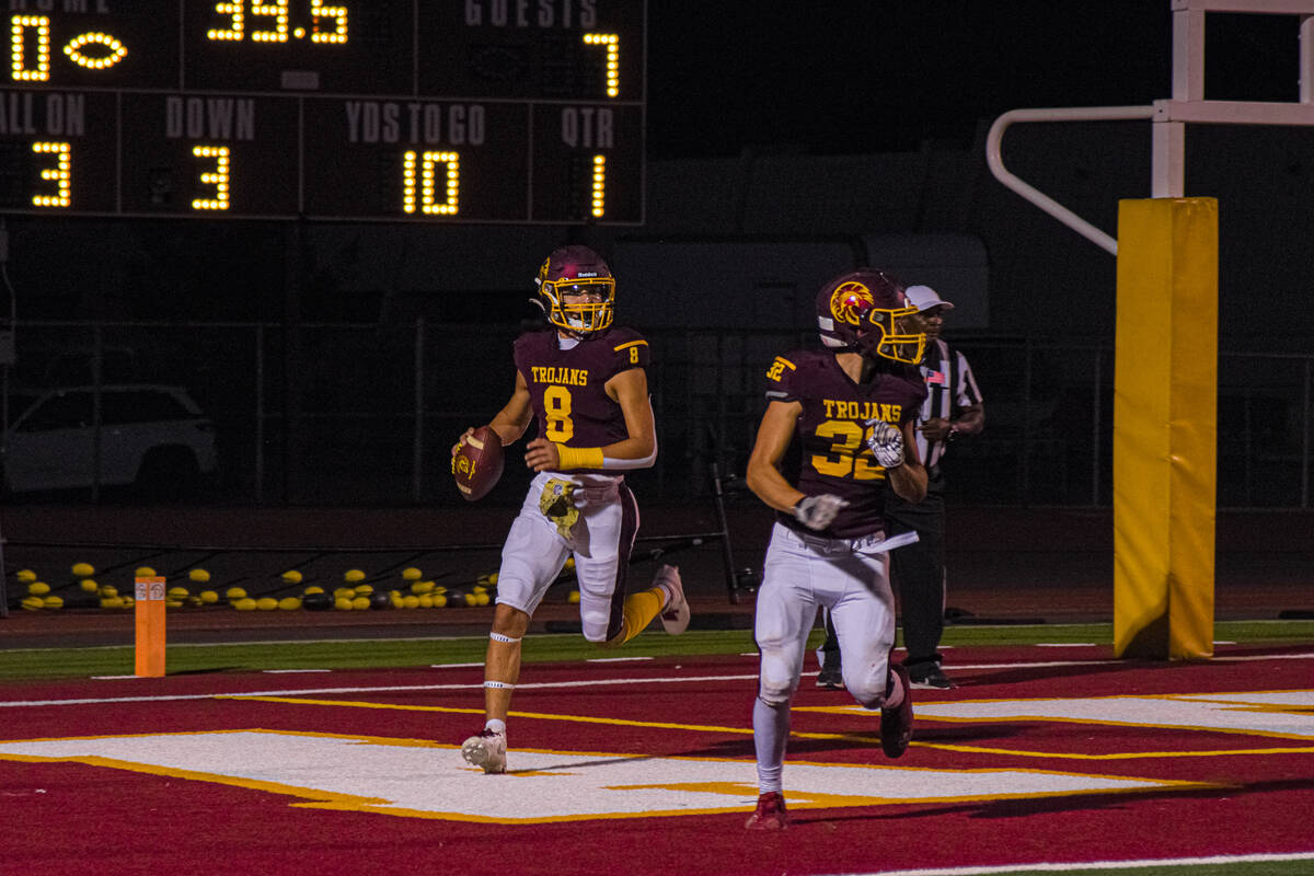 Trojan’s Kayne Horibe (8) runs the pass the ball while Sports Leadership and Management& ...