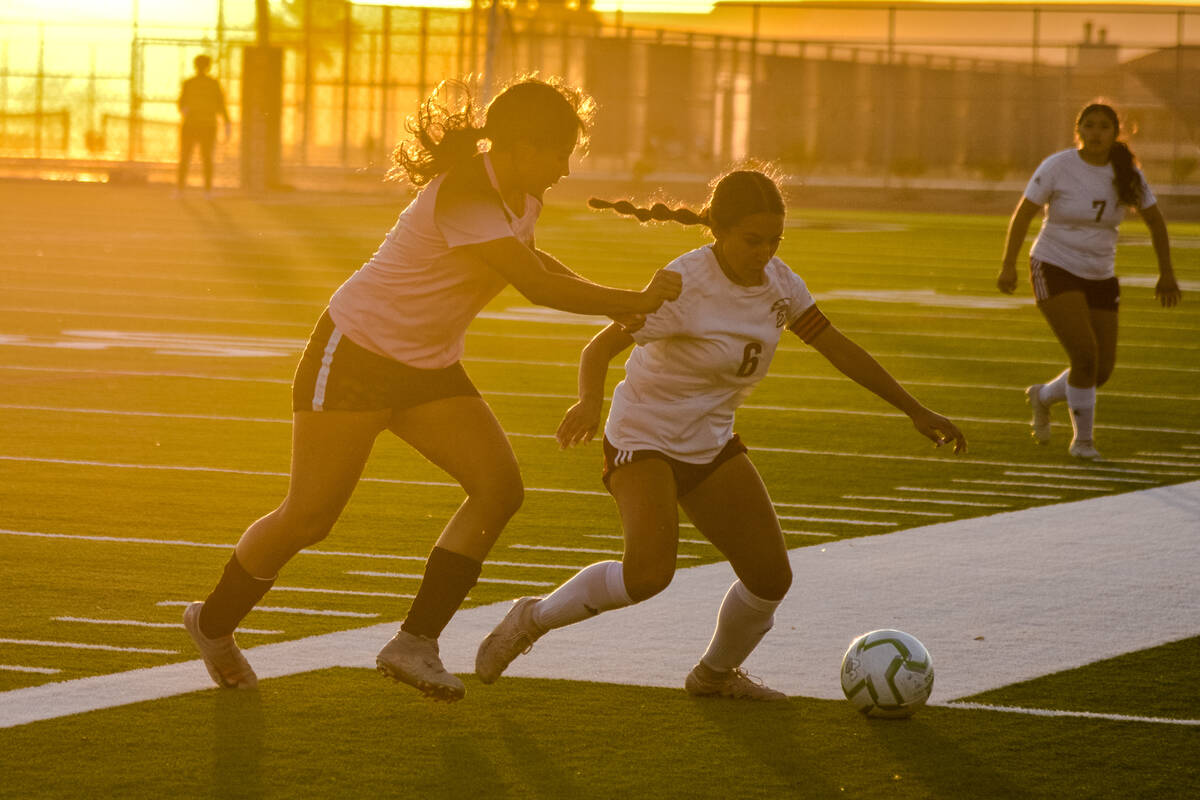 Pahrump Valley’s Natalia Vallin (6) attempts to hold possession of the ball against Virg ...