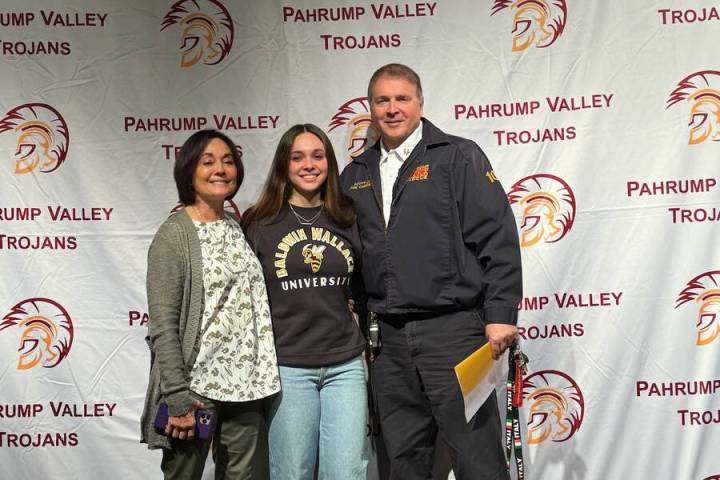 Special to the Pahrump Valley Times Emily Lewis, center, is joined by her parents Jamie, a VA ...