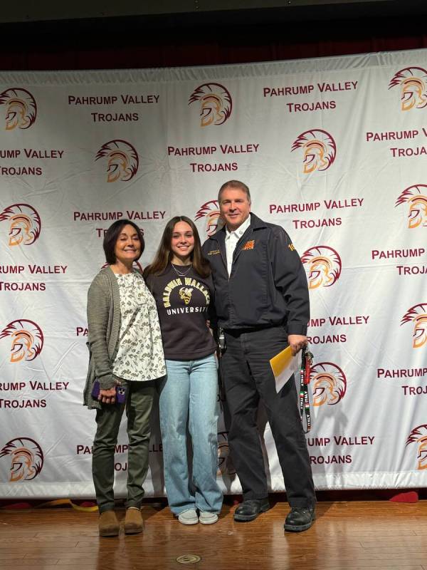 Special to the Pahrump Valley Times Emily Lewis, center, is joined by her parents Jamie, a VA ...